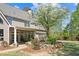 Spacious backyard features a stone-edged garden area and a covered patio area at 2839 Echols Rd, Cumming, GA 30041
