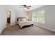 Cozy bedroom with carpet, neutral paint and a window bringing in natural light at 2839 Echols Rd, Cumming, GA 30041