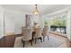 Formal dining room with a bay window and a stylish light fixture at 2839 Echols Rd, Cumming, GA 30041