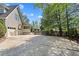 Long driveway leading to a three-car garage and fenced-in area at 2839 Echols Rd, Cumming, GA 30041