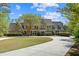 Inviting stone-clad home with mature landscaping, a circular driveway, and a stately presence at 2839 Echols Rd, Cumming, GA 30041