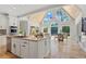 Bright kitchen with granite countertops, an island with seating, and vaulted ceilings at 2839 Echols Rd, Cumming, GA 30041