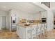 Bright kitchen with granite counters, white cabinets, tile floors, and stainless appliances at 2839 Echols Rd, Cumming, GA 30041