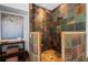 Custom shower with colorful stone tile walls, built-in seat, and dual shower heads at 2839 Echols Rd, Cumming, GA 30041