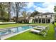 Expansive backyard featuring a rectangular pool, jacuzzi, and lounge chairs for relaxation at 315 Peachtree Battle Nw Ave, Atlanta, GA 30305