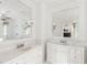 Bright bathroom with double vanities, marble countertops, and large mirrors at 315 Peachtree Battle Nw Ave, Atlanta, GA 30305