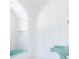 Bright bathroom with teal sink, white tile, and arched shower/tub at 315 Peachtree Battle Nw Ave, Atlanta, GA 30305