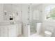 Bright bathroom showcasing a glass-enclosed shower, white fixtures, and classic design elements at 315 Peachtree Battle Nw Ave, Atlanta, GA 30305