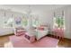 Charming bedroom with pink accents, showcasing bright natural light, and creating a playful and inviting atmosphere at 315 Peachtree Battle Nw Ave, Atlanta, GA 30305
