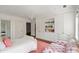 Cozy bedroom with a chandelier, large built-in wardrobe, and a comfortable chair, creating a relaxing retreat at 315 Peachtree Battle Nw Ave, Atlanta, GA 30305