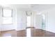 Sunlit bedroom includes hardwood floors, large built-in wardrobe, and access to a nearby bathroom at 315 Peachtree Battle Nw Ave, Atlanta, GA 30305