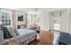 Bright bedroom with a daybed, built in wardrobe and large windows at 315 Peachtree Battle Nw Ave, Atlanta, GA 30305
