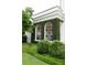 Stately home exterior with arched windows, covered in lush greenery, and manicured bushes at 315 Peachtree Battle Nw Ave, Atlanta, GA 30305