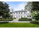 Elegant white home with manicured lawn and symmetrical design creates a stately and inviting curb appeal at 315 Peachtree Battle Nw Ave, Atlanta, GA 30305