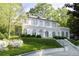 Attractive white exterior with dormer windows and landscaped front yard provides classic charm at 315 Peachtree Battle Nw Ave, Atlanta, GA 30305