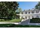 Elegant white home featuring a symmetrical facade, arched windows, and lush landscaping, offering timeless curb appeal at 315 Peachtree Battle Nw Ave, Atlanta, GA 30305