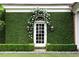 Elegant exterior featuring ivy, a doorway adorned with florals, and outdoor lanterns on a well-maintained lawn at 315 Peachtree Battle Nw Ave, Atlanta, GA 30305