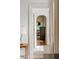 Inviting hallway with hardwood floors and arched doorways to additional rooms at 315 Peachtree Battle Nw Ave, Atlanta, GA 30305