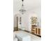 Hallway showcasing hardwood floors, arched doorways, a decorative chandelier, and access to other rooms in the house at 315 Peachtree Battle Nw Ave, Atlanta, GA 30305