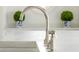 Close-up on a stainless steel faucet and a marble counter in a modern kitchen at 315 Peachtree Battle Nw Ave, Atlanta, GA 30305