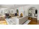 Spacious living room with hardwood floors, a fireplace, and plenty of natural light at 315 Peachtree Battle Nw Ave, Atlanta, GA 30305