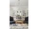 Elegant living room featuring hardwood floors, a fireplace, and arched doorways, creating a bright and inviting space at 315 Peachtree Battle Nw Ave, Atlanta, GA 30305