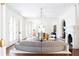 Bright and airy living room featuring elegant archways, a fireplace, and modern decor for comfortable living at 315 Peachtree Battle Nw Ave, Atlanta, GA 30305