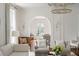 Elegant living room featuring hardwood floors, natural light, and a stunning chandelier, perfect for entertaining at 315 Peachtree Battle Nw Ave, Atlanta, GA 30305