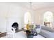 Chic living room featuring a fireplace, chandelier, stylish decor, and hardwood floors at 315 Peachtree Battle Nw Ave, Atlanta, GA 30305