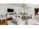 Bright living room with white sofas, hardwood floors, modern lighting and lots of natural light at 315 Peachtree Battle Nw Ave, Atlanta, GA 30305