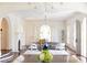 Bright and airy living room with high ceilings, chandeliers, fireplace, and elegant finishes at 315 Peachtree Battle Nw Ave, Atlanta, GA 30305