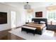 Spacious main bedroom boasts stylish decor, ensuite bathroom access, and abundant natural light at 315 Peachtree Battle Nw Ave, Atlanta, GA 30305