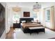 Bright main bedroom features a modern design, chic lighting, and a walkout to the yard at 315 Peachtree Battle Nw Ave, Atlanta, GA 30305
