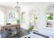 Office space featuring large arched windows, black tile floors, a chandelier, and an elegant desk at 315 Peachtree Battle Nw Ave, Atlanta, GA 30305