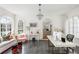 Bright office with modern desk, chandelier, large windows, and comfortable seating for a productive workspace at 315 Peachtree Battle Nw Ave, Atlanta, GA 30305