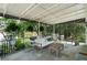 Inviting covered patio with stylish outdoor furniture and lush green surroundings, perfect for relaxation at 315 Peachtree Battle Nw Ave, Atlanta, GA 30305