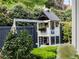 A backyard playhouse features a swing set and ladder for outdoor fun at 315 Peachtree Battle Nw Ave, Atlanta, GA 30305