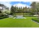 Beautiful backyard pool area with lounge chairs and lush green lawn offers a relaxing outdoor retreat at 315 Peachtree Battle Nw Ave, Atlanta, GA 30305