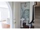 Chic powder room features a pedestal sink and blue and white wallpaper at 315 Peachtree Battle Nw Ave, Atlanta, GA 30305