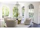 Cozy sitting room with four comfortable chairs, a round table and decorative chandelier at 315 Peachtree Battle Nw Ave, Atlanta, GA 30305