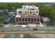 Aerial view showcasing building's rooftop deck and its urban surroundings at 112 Rogers Ne St # 207, Atlanta, GA 30317