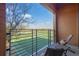 Relaxing balcony with chairs overlooking green soccer field and wooden siding at 112 Rogers Ne St # 207, Atlanta, GA 30317