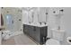 Modern bathroom with double vanity, sleek cabinets, and glass-enclosed shower at 112 Rogers Ne St # 207, Atlanta, GA 30317