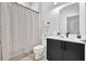 Modern bathroom with patterned shower curtain, sleek vanity, and contemporary fixtures at 112 Rogers Ne St # 207, Atlanta, GA 30317