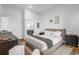 A bedroom showcasing hardwood floors, a neutral color scheme, and an ensuite bathroom at 112 Rogers Ne St # 207, Atlanta, GA 30317