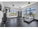 Well-equipped gym with modern machines, weights, and bright windows at 112 Rogers Ne St # 207, Atlanta, GA 30317