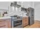 Close-up of a modern kitchen featuring stainless steel appliances and stylish backsplash at 112 Rogers Ne St # 207, Atlanta, GA 30317