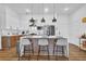 Bright modern kitchen featuring a central island with barstool seating and stainless steel appliances at 112 Rogers Ne St # 207, Atlanta, GA 30317