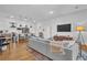 Open concept living space featuring a kitchen island and comfortable seating area at 112 Rogers Ne St # 207, Atlanta, GA 30317