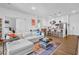Open concept living space with modern kitchen and comfortable seating arrangement at 112 Rogers Ne St # 207, Atlanta, GA 30317